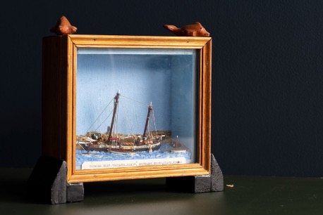 frame diorama of a wooden ship on water
