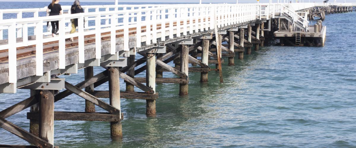 White jetty stretching out into the ocean